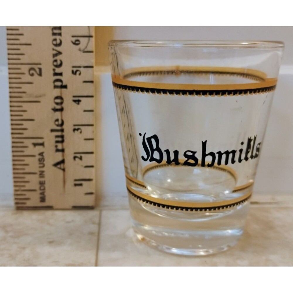 Vintage Bushmills Irish Whiskey Shot Glass Black Script Gold Bands Barware 2.25"